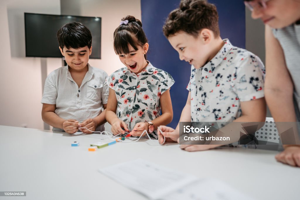 Elementary School Children Learning Programing Basics With Coding ...
