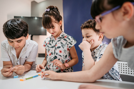 Elementary School Children Learning Programing Basics With Coding ...