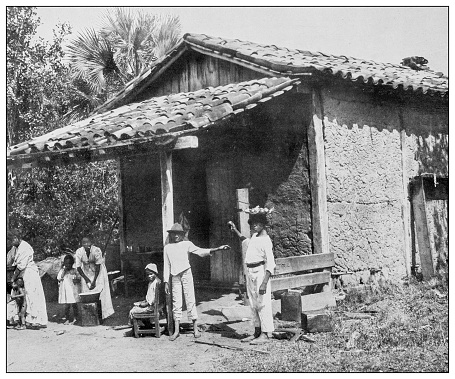 Antique black and white photograph of people from islands in the Caribbean and in the Pacific Ocean; Cuba, Hawaii, Philippines and others: House in Santa Fe, Cuba