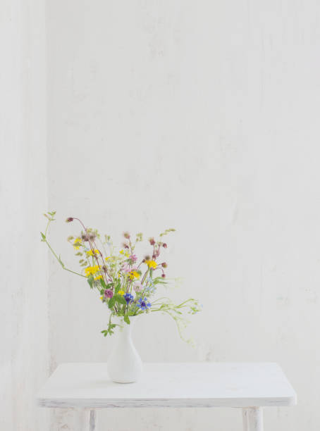 istock flowers in white vase in white vintage interior 1325439750