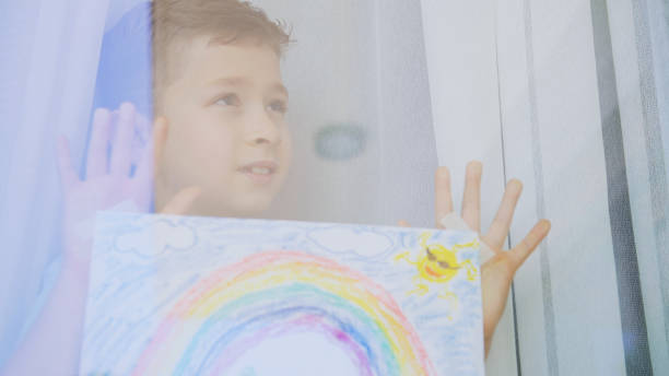 istock Boy with rainbow painting 1325440580