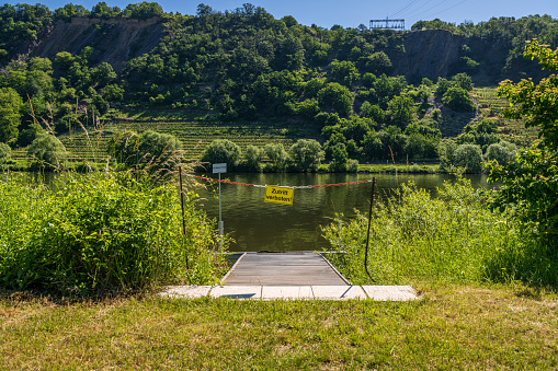 Sign: No entry, with the Moselle River in the background, seen in Coblenz-Guels, Rhineland-Palatine, Germany