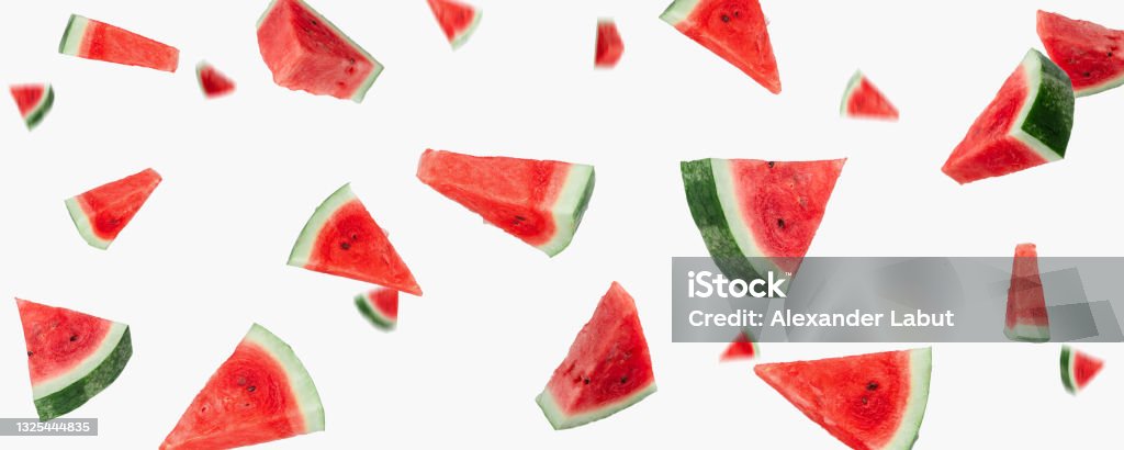 beautiful banner with many flying watermelon slices close-up on a white background Watermelon Stock Photo
