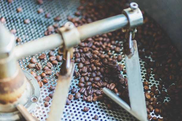 istock coffee bean roaster machine equipment working for beverage business job, roasting preparation process for coffee cafe, aromatic brown coffee roasted, aroma espresso hot drink 1325447437