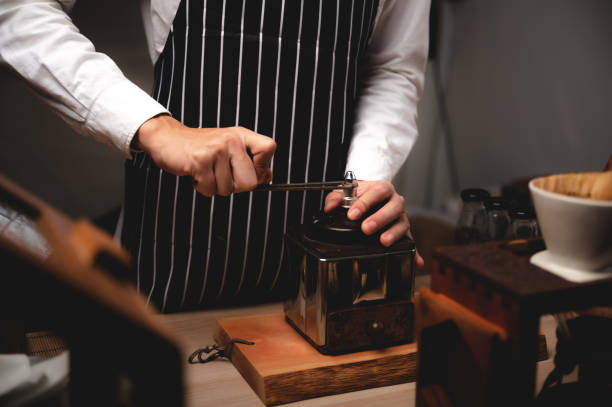 istock professional barista making espresso coffee to a drink cup in cafe, beverage caffeine machine, person pouring hot water with hand, business in the morning breakfast, fresh aroma in hot drink 1325448110