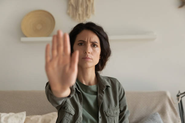 istock Close up serious strong woman showing stop gesture with hand 1325452759