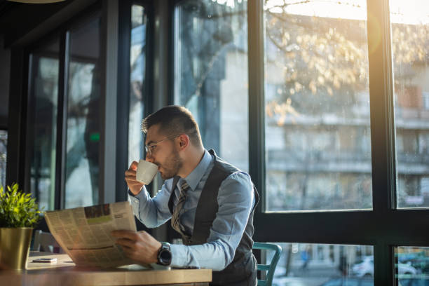 istock A young businessman on a break from work, spends time in a cafe. 1325453532