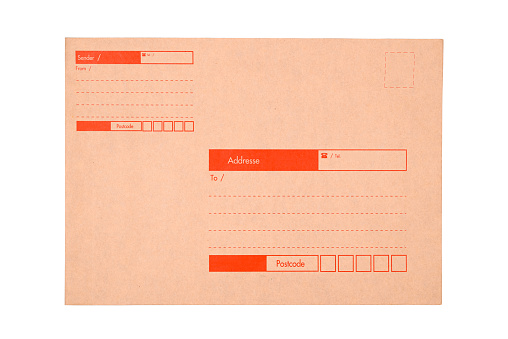 Brown envelope for A4 documents with sender and destination index blank to fill in, with postcode, isolated on white background