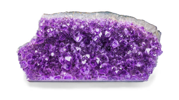 istock a large purple amethyst nugget on a white isolated background. 1325459657