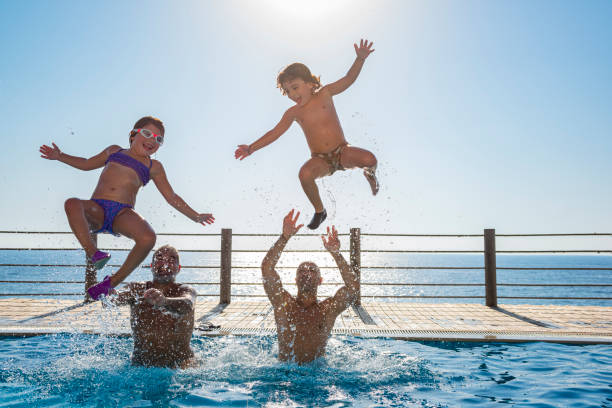 istock Happy People in the Pool 1325468175