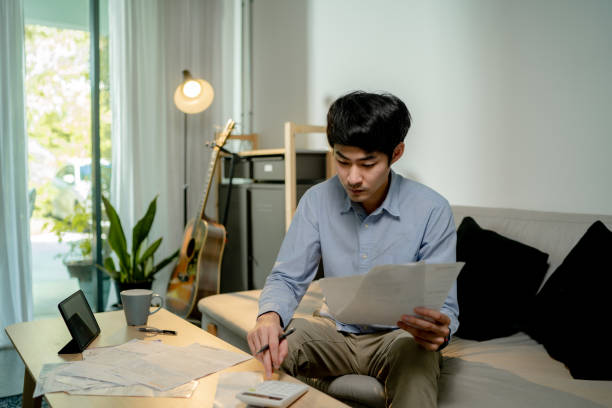 istock Man checking of account statements. 1325470383