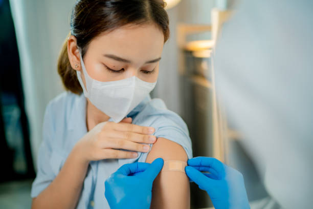 istock Young woman getting covid vaccine. 1325470449