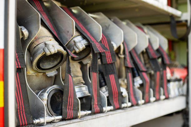 istock Fire truck equipment. Compartment of the rolled up fire hoses on a fire engine. 1325471950