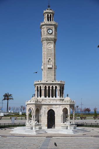 Yozgat, Turkey - April 20, 2018: People on the street with clock tower view in Yozgat. It was built by an ottoman pasha who is called Tevfikizade Ahmet Bey in 1908.