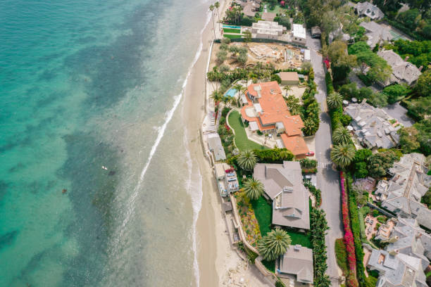 istock Aerial over houses along beach 1325473751