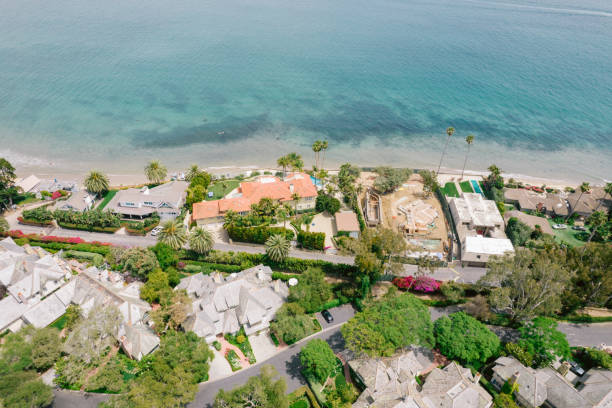istock Aerial over houses along beach 1325473775