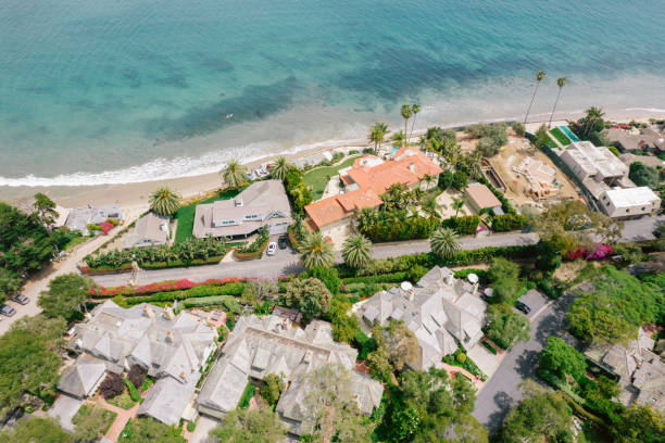 istock Aerial over houses along beach 1325473776