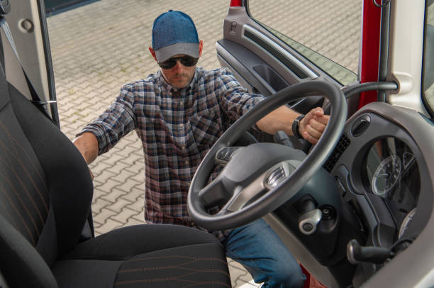 istock Caucasian Trucker Getting Into Truck Cabin 1325474160