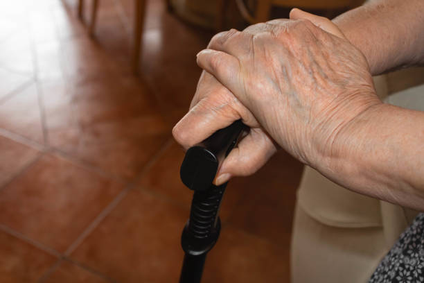 istock A senior woman's hands  holding a walking cane, indoors, top view 1325480823