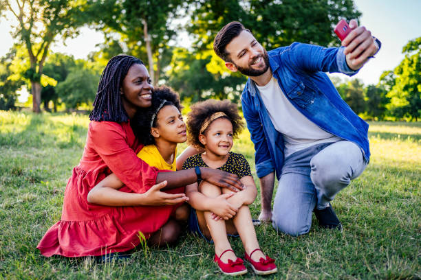 istock Happy family making selfies 1325483547