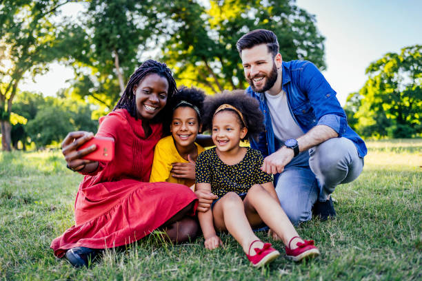 istock Happy family making selfies 1325483593