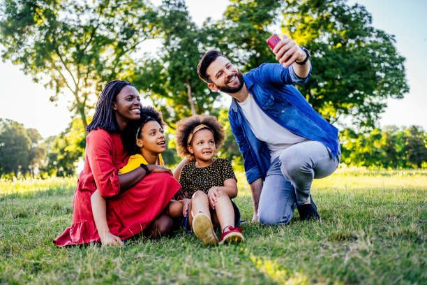 istock Happy family making selfies 1325483603