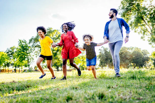 istock Family having fun in park 1325483742