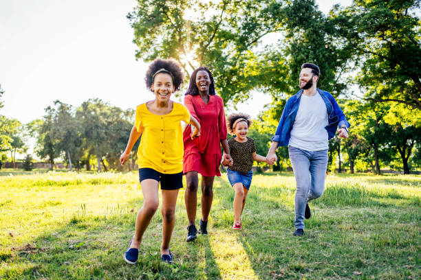 istock Family having fun in park 1325483817