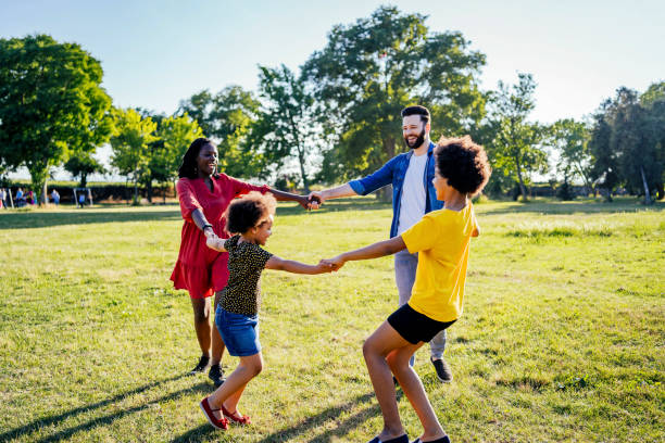 istock Happy family playing ring around the rosy 1325484376