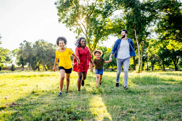 istock Family having fun in park 1325484390