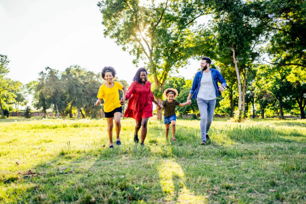 istock Family walking through the park 1325484421