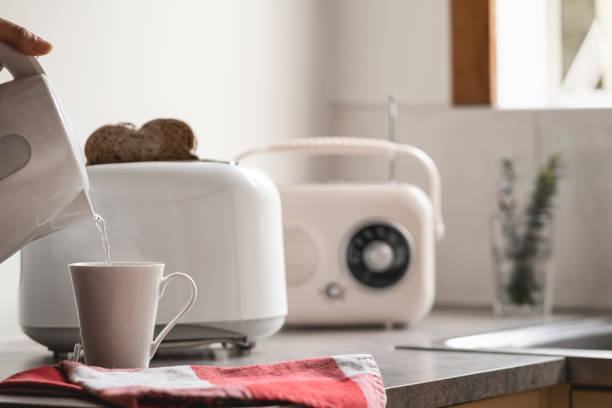 breakfast time with electric kettle, toaster and an old vintage radio. - food staple audio imagens e fotografias de stock