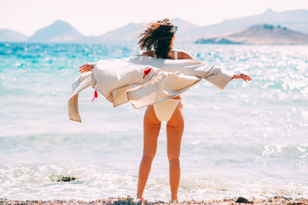 Happy Woman Posing in Bikini on the Beach
