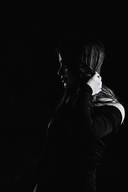 istock Black Haired Woman In Darkness 1325488738