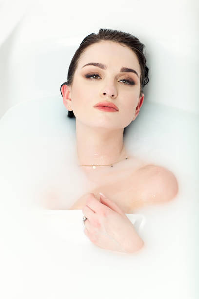 istock Woman Taking Bath In Milky Water 1325488781