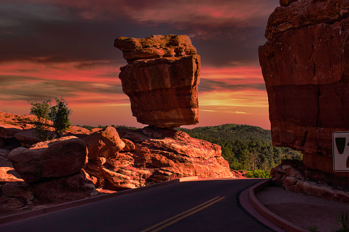 Balanced Rock is a natural rock formation in Garden of the Gods. Colorado Springs, Colorado. The rocks are red, pink, white sandstone and limestone conglomerate.