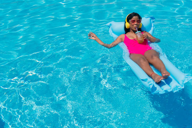 istock Woman sunbathing drinking a juice 1325502262