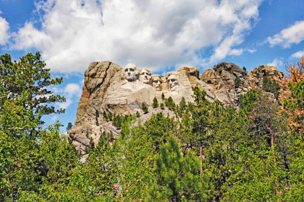 Mount Rushmore with Clouds from below stock photo