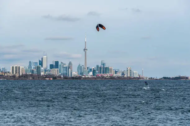 Kitesurfing in Ontario lake in winter day