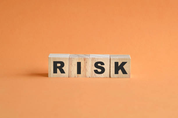 istock Risk word on wooden cubes arranged on a row. 1325505660
