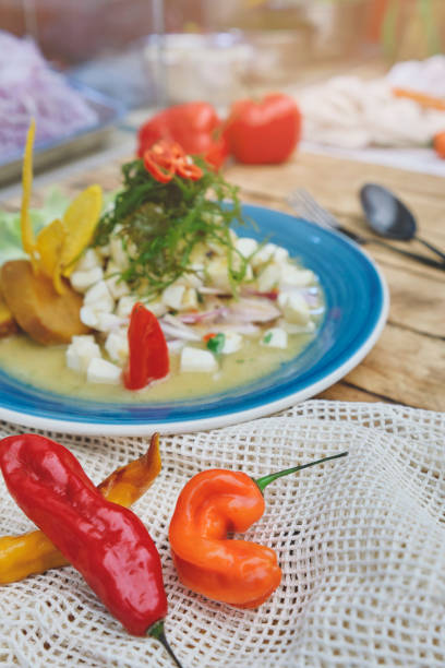 istock Peruvian food: fish ceviche de giant squid, served on a blue plate, Top view. 1325507118