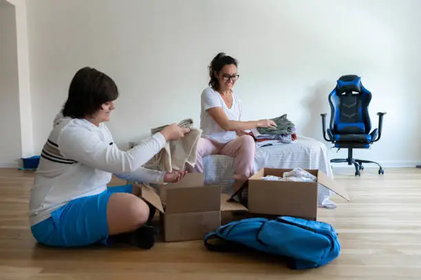 Mother and Son arriving at the new house