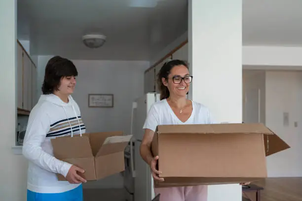 Mother and Son arriving at the new house