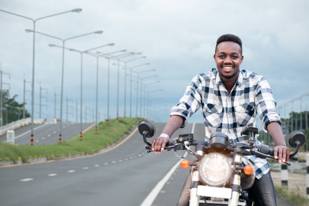istock African biker man riding a motorcycle rides on highway road 1325516338