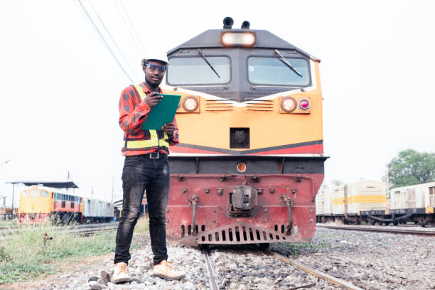 istock African engineer   control and check report of the train on railway 1325516397