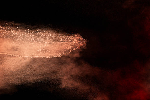 istock Abstract brown dust explosion on black background.Brown powder splashing. 1325517334