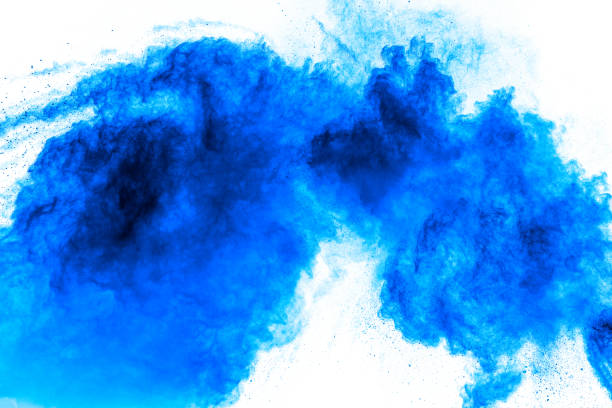 istock Blue color dust particles splash on white background. Explosion of Holi powder. 1325517337