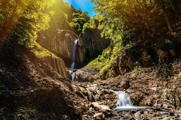 istock Beautiful waterfall in the mountains 1325522356