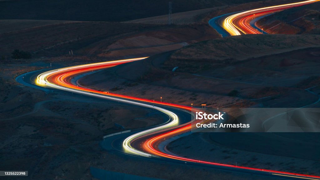 Mountain pass road at night The Way Forward Stock Photo