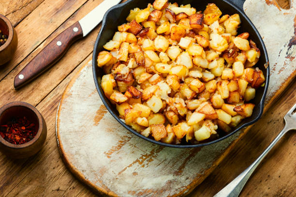 istock Roasted potatoes in iron skillet 1325527581